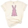 A retro-inspired Easter bunny with pink accents surrounded by spring flowers.