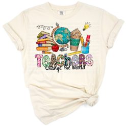 Colorful artwork featuring apple, pen, and crayons arranged with a cheerful teacher message.