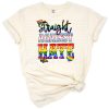 A bold rainbow heart design with pride-themed grunge effects and the phrase love is love.
