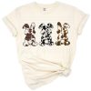 Three bunny rabbits with cowhide print patterns side by side in a cheerful Easter style.