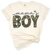 A playful illustration of a little boy with the words Mama's Boy in cute, bold lettering.