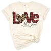 A heart featuring a buffalo plaid and leopard print pattern in a romantic style.