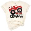 A cartoon monster truck decorated with hearts and a playful Valentine’s theme.