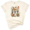 A whimsical fox surrounded by soft watercolor florals in a boho style.