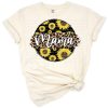 A cheerful sunflower with leopard and cheetah print brush strokes surrounding the word 'mama'.