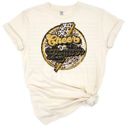 A retro leopard print cheerleader with a gold lightning bolt and sports-inspired accents.