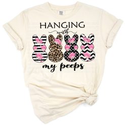 Three bunnies in blush, floral, leopard, and stripe patterns grouped for a cheerful Easter design.