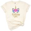 A pastel unicorn with rainbow hair and a party crown surrounded by stars for a birthday theme.