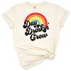 A playful retro style graphic with the words Day Drinking Crew in bold, colorful letters.