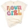 A retro groovy flower girl with colorful floral accents in a cheerful design.