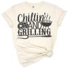 Funny barbecue dad standing at the grill with retro styled text and playful design elements.