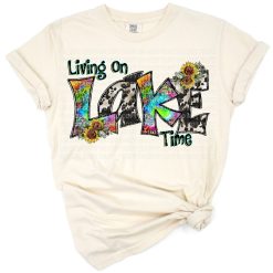 A colorful retro tie dye western themed design with the phrase Living On Lake Time.