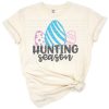 Silhouette artwork of children hunting for Easter eggs.