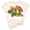 A colorful scene featuring cowhide pattern, cactus, and sun in a summer camping setting.