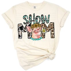 A pig with sunflowers and cowhide accents in a western farm style design.