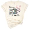 A cheerful Easter bunny mom with a boho style and playful spring elements.