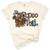 A bold Western rodeo graphic featuring horses, cowboy motifs, and ranch accents.