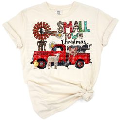 A festive illustration of a vintage truck beside a windmill with western small town Christmas decorations.