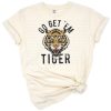 Retro styled tiger with motivational phrase in vintage colors.