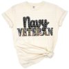 Grunge-style camo leopard American flag with navy veteran text and patriotic elements.