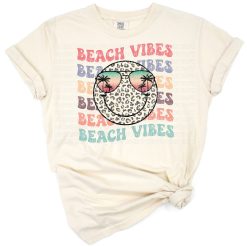 A colorful retro leopard print smiley face with beach and summer themed accents.