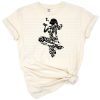 A cute floral mermaid surrounded by seashells and decorative flourishes with a whimsical style.