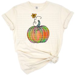 A bright orange hand drawn watercolor pumpkin with colorful painted accents in a whimsical style.