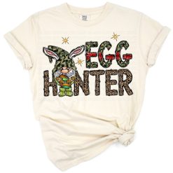 A gnome with bunny ears holding Easter eggs, surrounded by leopard pattern and festive accents.