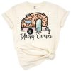 A retro happy camper design with leopard print details and camping elements.