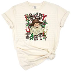 A cowboy Santa Claus wearing a hat and boots with western Christmas decorations.