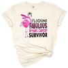 A cheerful pink flamingo with a breast cancer ribbon accent and supportive details.