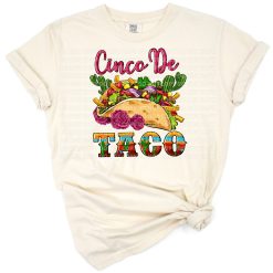 A colorful illustration of a festive sugar skull with a sombrero and tacos.
