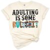 A bull skull with a distressed funny adulting quote in a bold western style.