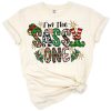 Hand drawn playful elf in western holiday style with festive Christmas accents.