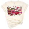 A pink coffee cup with a heart and western-inspired accents for moms.