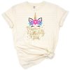 A colorful unicorn with flowers and the phrase Mom of the Birthday Girl in a cute style.