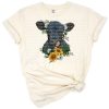 A black Angus calf with sunflowers and floral accents in a rustic farm style.