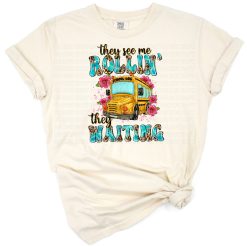 A playful yellow school bus with a humorous phrase in a distressed design.