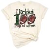 Cartoon football bouncing next to bold 100 days of school lettering