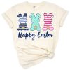 Three cheerful bunny rabbits with navy and pale teal floral accents in a playful spring arrangement.