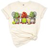A group of playful gnomes dressed for tennis with rackets and sports accessories.