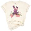 A pink bunny with leopard spots and floral accents.