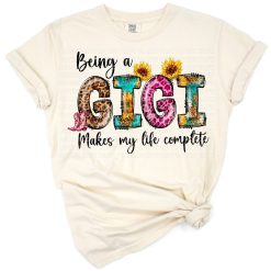 A playful retro style design featuring the phrase Being a Gigi Makes My Life Complete with colorful accents.