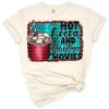 A mug of hot cocoa surrounded by festive Christmas elements and movie themed accents.