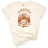 A retro-style campfire surrounded by desert trees and a vintage sunset in boho colors.